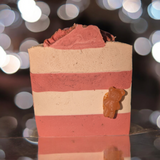 a handcrafted cold process soap with a naturally textured surface. Infused with chamomile tea and chamomile‑infused olive oil and enriched with coconut oil, avocado oil, and tussah silk, it gently cleanses, nourishes, and hydrates, leaving a delicate scent of apple, peach, rose, and musk.